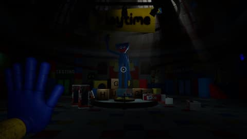 Poppy Playtime gameplay scene facing Huggy Wuggy